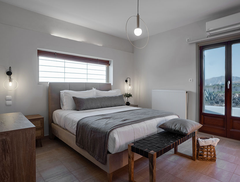 Master bedroom at Echo Villa in Santorini with double bed and natural light